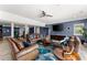 Spacious basement featuring multiple seating areas, tv and bar area with tiled floors at 1572 Azalea Dr, Lawrenceville, GA 30043