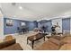 Finished basement features open floor plan with exercise equipment and seating area at 1572 Azalea Dr, Lawrenceville, GA 30043
