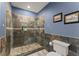 Modern bathroom with a glass-enclosed shower and tiled walls at 1572 Azalea Dr, Lawrenceville, GA 30043
