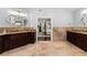 Bathroom boasts granite double vanity and tile flooring leading into the main bedroom at 1572 Azalea Dr, Lawrenceville, GA 30043