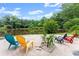 Lake view with a line of Adirondack chairs on the beach at 1572 Azalea Dr, Lawrenceville, GA 30043