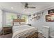 Inviting bedroom with a relaxing ambiance and decorative wall art at 1572 Azalea Dr, Lawrenceville, GA 30043