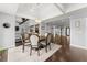 Elegant dining room with dark wood floors and modern lighting fixtures at 1572 Azalea Dr, Lawrenceville, GA 30043