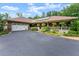 Charming home featuring an attached two-car garage, a welcoming front porch, and mature landscaping at 1572 Azalea Dr, Lawrenceville, GA 30043