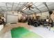 Inside a steel garage with a fan, lighting, and equipment at 1572 Azalea Dr, Lawrenceville, GA 30043