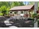 Beautiful gazebo with seating, ideal for outdoor gatherings and enjoying the tranquil garden setting at 1572 Azalea Dr, Lawrenceville, GA 30043