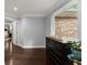 A clean, simple hallway with light gray walls, wood floors, and natural light at 1572 Azalea Dr, Lawrenceville, GA 30043