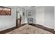 Light and bright hallway with wood-look floors and wall art at 1572 Azalea Dr, Lawrenceville, GA 30043