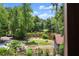 Gorgeous lake view from the property with a seating area and firepit to enjoy the outdoor scenery at 1572 Azalea Dr, Lawrenceville, GA 30043