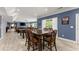 Open-concept living room with hardwood floors, and large-screen TV at 1572 Azalea Dr, Lawrenceville, GA 30043