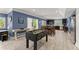 Entertaining living room with game table, dining area, and updated kitchen at 1572 Azalea Dr, Lawrenceville, GA 30043