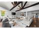Open-concept living area with dark wood floors and multiple seating areas at 1572 Azalea Dr, Lawrenceville, GA 30043