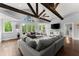 Well-lit living room with dark wood floors and views of the surrounding greenery at 1572 Azalea Dr, Lawrenceville, GA 30043
