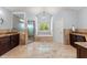 A spacious main bathroom with tiled floor, large soaking tub, and separate shower at 1572 Azalea Dr, Lawrenceville, GA 30043
