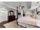 Spacious main bedroom with tray ceiling, dark wood floors, and sitting area at 1572 Azalea Dr, Lawrenceville, GA 30043