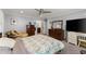 Spacious main bedroom with neutral paint, ceiling fan, carpet, and ensuite bathroom at 1572 Azalea Dr, Lawrenceville, GA 30043