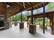 Outdoor living with covered patio, pool, grilling area and bar at 1572 Azalea Dr, Lawrenceville, GA 30043