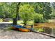 Lakeside with a charming paddleboat, blending recreation with nature at 1572 Azalea Dr, Lawrenceville, GA 30043