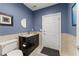 Powder room featuring dark vanity, and tiled flooring at 1572 Azalea Dr, Lawrenceville, GA 30043