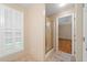Hallway to bathroom featuring shower with gold frame and tile floor at 2140 Old Orchard Lane Ln, Canton, GA 30114