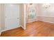 Inviting foyer featuring hardwood floors and a view into the dining room at 2140 Old Orchard Lane Ln, Canton, GA 30114