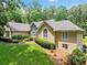 Attractive front exterior with well-manicured lawn and charming architectural details at 2140 Old Orchard Lane Ln, Canton, GA 30114