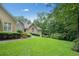 Well-manicured front yard featuring lush lawn and beautiful landscaping leading to a lovely home at 2140 Old Orchard Lane Ln, Canton, GA 30114