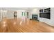 Spacious living area with hardwood floors, a fireplace, and ample natural light from the adjacent dining space at 2140 Old Orchard Lane Ln, Canton, GA 30114