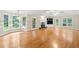 Expansive living area featuring hardwood floors, a fireplace, built-ins, and abundant natural light at 2140 Old Orchard Lane Ln, Canton, GA 30114