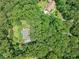 Aerial view of home surrounded by mature trees and lush landscaping at 2140 Old Orchard Ln, Canton, GA 30114