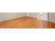 Neutral bedroom with hardwood floors, and a doorway to the en-suite bathroom at 2140 Old Orchard Ln, Canton, GA 30114