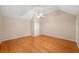 Large bedroom with hardwood floors and vaulted ceiling at 2140 Old Orchard Ln, Canton, GA 30114