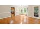 Elegant dining room featuring hardwood floors, large windows, and access to an outdoor area at 2140 Old Orchard Ln, Canton, GA 30114