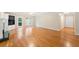 Spacious living room with hardwood floors, a fireplace, built-in shelving, and abundant natural light at 2140 Old Orchard Ln, Canton, GA 30114