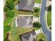Aerial view of the home featuring a fire pit and outdoor living space in a landscaped backyard at 3015 Arbor Song Ct, Cumming, GA 30041