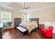 Well-lit primary bedroom with tray ceiling and abundant natural light at 3015 Arbor Song Ct, Cumming, GA 30041