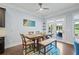 Bright dining area with access to the back deck, adjacent to the kitchen and living areas at 3015 Arbor Song Ct, Cumming, GA 30041