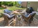 Inviting outdoor fire pit with stone surround and comfortable seating for cozy gatherings at 3015 Arbor Song Ct, Cumming, GA 30041