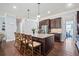 Spacious kitchen boasts a granite island with bar seating and stainless steel appliances at 3015 Arbor Song Ct, Cumming, GA 30041