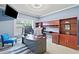 Spacious office with custom cherry wood cabinetry, blue accent walls, and natural light at 3015 Arbor Song Ct, Cumming, GA 30041