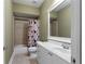 Neutral-toned bathroom with a shower/tub combination and a bright vanity with large mirror at 32 Pullman Trl, Acworth, GA 30101