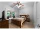 Cozy bedroom with natural light, neutral colors, and wood accents at 32 Pullman Trl, Acworth, GA 30101