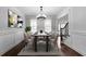 Dining room featuring neutral walls, a modern chandelier, and seating for eight guests at 32 Pullman Trl, Acworth, GA 30101
