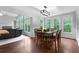 Dining room featuring hardwood floors, natural light, and views of the living room at 32 Pullman Trl, Acworth, GA 30101