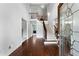 Elegant foyer with hardwood floors, a staircase with iron railings, and high ceilings at 32 Pullman Trl, Acworth, GA 30101