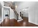 Grand foyer with hardwood floors, staircase, and views into the living and dining areas at 32 Pullman Trl, Acworth, GA 30101