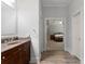 Hallway between the bathroom and main bedroom with wood-look flooring and light paint at 32 Pullman Trl, Acworth, GA 30101