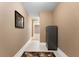 A wide hallway with tile flooring and a painting on the wall at 32 Pullman Trl, Acworth, GA 30101