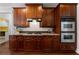 Traditional kitchen with wood cabinets, granite countertops, and stainless steel appliances at 32 Pullman Trl, Acworth, GA 30101