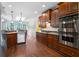 Kitchen with stainless steel appliances, dark cabinets, and an eat-in area with natural light at 32 Pullman Trl, Acworth, GA 30101